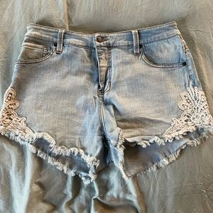 Light wash denim cut off shorts with crochet detailing